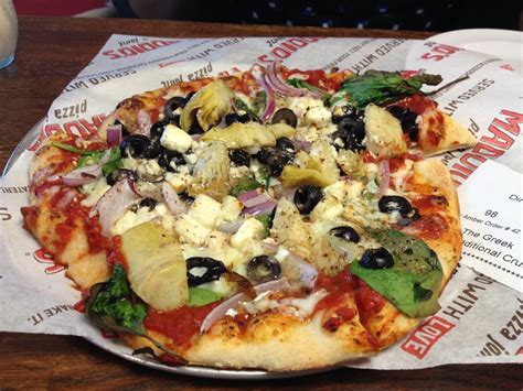 Uncle maddio's pizza joint - A 9-inch individual pizza with up to three toppings sells for $6.99 at Uncle Maddio’s. As guests proceed down the assembly line, there are 48 toppings to choose from, with six sauces, 27 vegetables, and 15 meats.